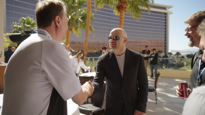 Chad E. Foster shakes hands with audience member